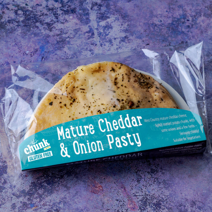 Packaged gluten free Mature Cheddar & Onion Pasty with 'chunk' branding on a textured purple background
