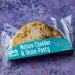 Packaged gluten free Mature Cheddar & Onion Pasty with 'chunk' branding on a textured purple background