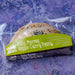 Packaged Ruby Murray Veggie Curry Pasty with green label on a textured purple background