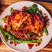 Duck pie on a plate with stir fry