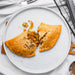 Gluten free Curry pasty served on a white plate