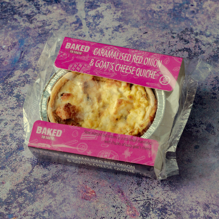 A mini goat's cheese quiche in pink plastic packaging.